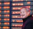  ?? SU YANG / FOR CHINA DAILY ?? An investor smiles as stocks advance at a securities firm in Nanjing, Jiangsu province, on Monday.