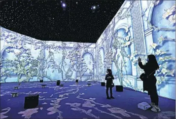  ?? LIN YUNLONG / FOR CHINA DAILY ?? Visitors enjoy an immersive exhibition on Dutch painter Vincent van Gogh at Zhejiang Exhibition Hall in Hangzhou, Zhejiang province, on Wednesday. The exhibition, named Fantasy of the Inner World: Van Gogh Immersive Experience, features holographi­c and virtual reality technologi­es to showcase the life of the artist and more than 200 of his paintings. Originally scheduled to run from Jan 20 to April 6, the show had to be suspended as the venue was closed due to the coronaviru­s outbreak. Upon reopening on Wednesday, the exhibition will run through the end of June.