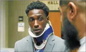  ?? ASSOCIATED PRESS FILE ?? Richard Hubbard III, who was seen on video being punched by a police officer multiple times during a traffic stop, speaks to a supporter after an August news conference.