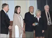  ?? Diane Wagner / RN-T ?? Larry Morrow Sr. (center), a founder of both First Rome Bank (now Regions) and the 100 Black Men of Rome/ NWGA, is recognized by the County Commission Tuesday.