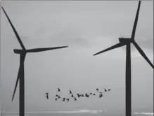  ?? CHRISTOPHE­R FURLONG / GETTY IMAGES ?? Wind turbines on the River Mersey estuary in Runcorn, England, on Monday.