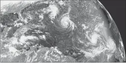  ?? NOAA VIA ASSOCIATED PRESS ?? THIS ENHANCED satellite image made shows Tropical Storm Florence, the circular storm at top center, in the Atlantic Ocean on Saturday, with the U.S. coast at the top left. To the right of Florence is Tropical Storm Isaac, and at right is Tropical Storm Helene off the coast of Africa. Helene became a tropical storm Friday; Isaac followed on Saturday.