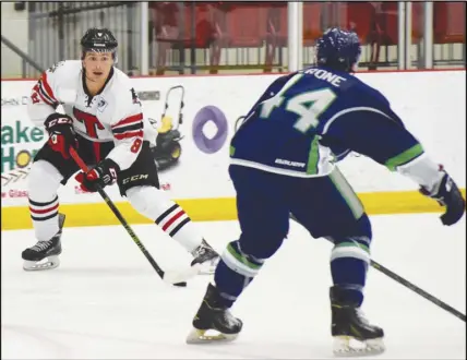  ?? CoDy MCeaCherN/truro Daily NewS ?? Ryan Porter of the Truro Bearcats handles the puck in the offensive zone and looks at his options during MHL action on Saturday. The Bearcats defeated the St. Stephen Aces 5-3 in their home opener.