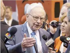  ?? — Reuters ?? Berkshire Hathaway CEO Warren Buffett talks to reporters prior to the Berkshire annual meeting in Omaha, Nebraska, in this file photo.