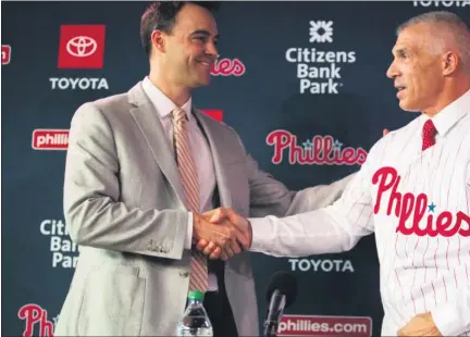  ?? THE ASSOCIATED PRESS FILE ?? All was optimistic when Phillies general manager Matt Klentak, left, welcomed new manager Joe Girardi to town last winter. That was before a pandemic-ruined season and 60-game Phillies pratfall led to Klentak losing his position Saturday.
