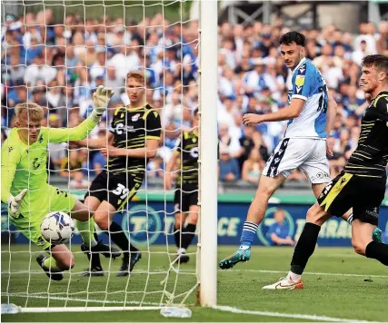  ?? Picture: Getty Images ?? Aaron Collins scores Bristol Rovers’ sixth goal against Scunthorpe United at Memorial Stadium