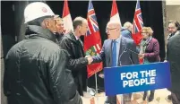  ?? STEVE RUSSELL TORONTO STAR ?? Housing Minister Steve Clark, centre right, meets developers and builders Wednesday at a new purpose-built rental building.