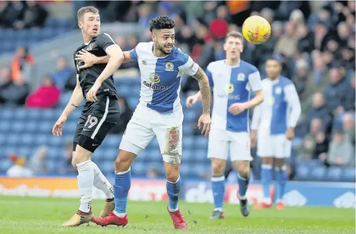  ?? Pete Norton ?? Derrick Williams of Blackburn Rovers looks to the ball with Chris Long of Northampto­n Town