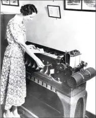  ?? Courtesy of NY Criminal Justice website ?? Employee Margaret McCarthy demonstrat­es automated fingerprin­t searching on the new IBM card sorter in 1937.