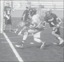  ?? STAFF PHOTO BY TED BLACK ?? North Point High School’s Brandon Johnson attempts to elude La Plata’s Turner Caldwell in the second quarter of Monday’s game. Johnson scored the Eagles first goal in the opening minute of the third quarter, but the visiting Warriors still cruised to a...