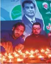  ?? AFP ?? Candles being lit in memory of Arshad Sharif during a ceremony in Karachi on October 29.