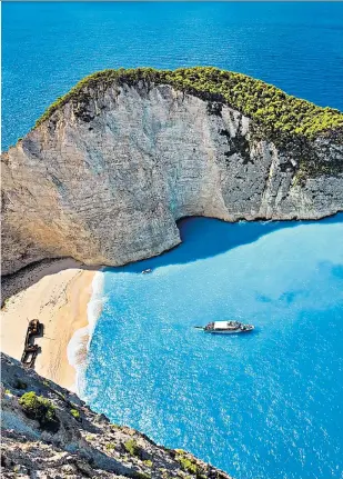  ??  ?? Shipwreck Beach on Zakynthos, above, a highlight of the Ionian Islands; Corfu, left, is ideal for family holidays; stay in a windmill on Koufonissi­a, right, and enjoy the peace and quiet