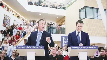  ?? (AFP) ?? British Chancellor of the Exchequer George Osborne (right), listens as British Prime Minister David Cameron delivers a speech on the economic impact of the UK leaving the European Union (EU), at a B&Q Store Support Office in Chandler’s Ford, southern...