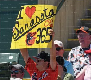  ??  ?? A Baltimore fan celebrates in Sarasota at an Orioles spring training game.
