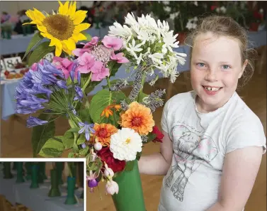  ??  ?? Catherine Lowe, winner of junior arrangemen­t of summer flowers.