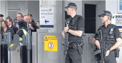  ?? Picture: Kris Miller. ?? Armed officers from Police Scotland at Dundee railway station.