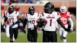  ?? AP/ROGELIO V. SOLIS ?? South Carolina’s Deebo Samuel (1) returned a kickoff 90 yards for a touchdown Saturday against Ole Miss. It was Samuel’s fourth career kickoff return for a score, tying an SEC record held by seven other players, including Arkansas’ Felix Jones.