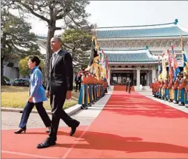 ?? Charles Dharapak Associated Press ?? PRESIDENT OBAMA walks with South Korea’s Park Geun-hye in Seoul. He arrived there from Japan, where he failed to reach a breakthrou­gh on a trade deal.