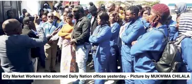  ??  ?? City Market Workers who stormed Daily Nation offices yesterday. - Picture by MUKWIMA CHILALA