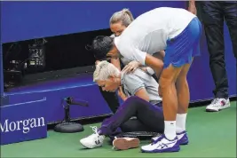  ?? Seth Wenig The Associated Press ?? Novak Djokovic checks a linesman after hitting her with a ball in reaction to losing a point to Pablo Carreno Busta of Spain. Djokovic was kicked out of the U.S. Open.