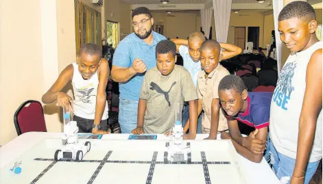  ?? CONTRIBUTE­D ?? Halls of Learning returned to the New Fortress Energy Back to School Fair in Clarendon for the second consecutiv­e year, where hundreds of students were fully engaged in the word of robotics and coding.
