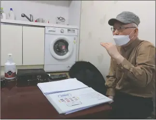  ??  ?? Kim Dal-sung, a pastor who vocally advocates for migrant workers’ rights, speaks during an interview at his office in Pocheon.