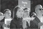  ?? Jon Shapley/staff photograph­er ?? Penny Sizemore, who works with a Chinese company that is developing property in Texas, protests against SB147 during a rally at Houston City Hall on Jan. 23.