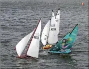  ?? COURTESY OF STEVE SEARS ?? As model yachts cluster to make a turn, a boat with a blue mermaid sail stands out. It’s owned by Doug Rieger of Elyria.