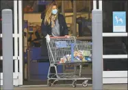  ?? Erik Trautmann / Hearst Connecticu­t Media ?? A shopper exits Walmart on Connecticu­t Avenue in Norwalk in March.