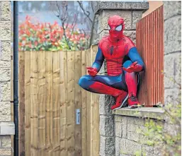  ?? Brown. Pictures: Steve ?? Top: Dave Roper and family. Right: The 36-year-old takes a break Spider-Man-style.