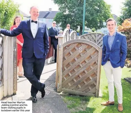  ??  ?? Head teacher Martyn Jobling (centre) and his team visiting pupils in lockdown earlier this year