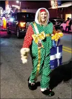  ?? Westside Eagle Obseerver/RANDY MOLL ?? A group of neighbors from South Little Street passed out stuffed toys during the Gentry Christmas Parade on Saturday.