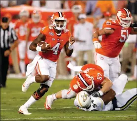  ?? AP PHOTO ?? Clemson quarterbac­k Deshaun Watson (4) breaks into the open field as offensive lineman Jay Guillermo (57) blocks Georgia Tech defensive lineman Kyle Cerge-Henderson (54).