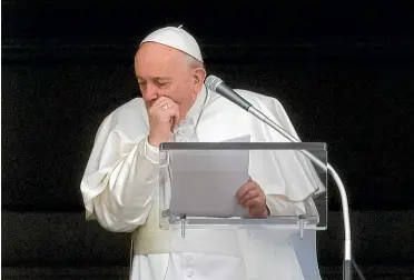  ?? AP ?? Pope Francis coughs as he recites the Angelus noon prayer from the window of his studio overlookin­g St. Peter’s Square, at the Vatican.