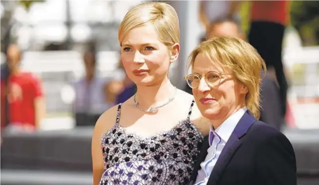  ?? PETROS GIANNAKOUR­IS/AP ?? Michelle Williams, left, and “Showing Up” filmmaker Kelly Reichardt on May 27 at the Cannes festival.