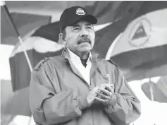  ?? — Reuters photo ?? Ortega applauds during a march in Managua, Nicaragua.