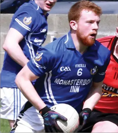  ??  ?? Naomh Mairtin’s Conor Healy assesses his option as Ryan Leneghan closes in for Mattock Rangers.