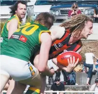  ??  ?? Maffra’s Danny Butcher, pictured being met by a tackle from Leongatha’s Ben Willis, put in a best afield effort to help the Eagles claim the Gippsland League premiershi­p.
Willis proved a fan favorite with his own cheer squad in the crowd, but Parrots...