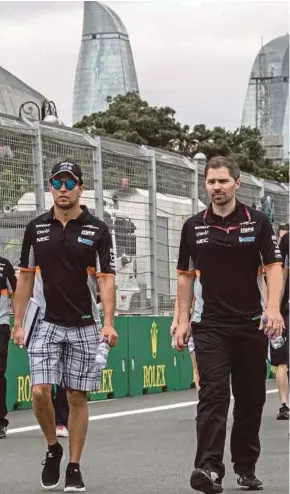  ?? EPA PIC ?? Sergio Perez of Sahara Force India F1 Team (left) inspects the track at the Baku City Circuit in Azerbaijan on Thursday.