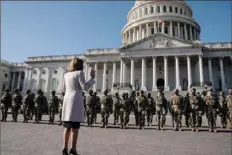  ?? Anna Moneymaker/The New York Times ?? Speaker of the House Nancy Pelosi, D-Calif., meets with National Guard troops Wednesday outside the U.S. Capitol in Washington.