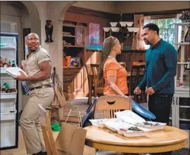  ?? Lara Solanki Netf lix ?? “THE UPSHAWS” features, from left, Page Kennedy, Kim Fields and Mike Epps.