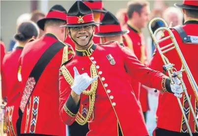  ?? Picture: Steve MacDougall. ?? Members of the New Zealand Army Band were all smiles at Crieff Highland Gathering on Sunday, where the pipe band competitio­n was boosted with a £3,000 grant.