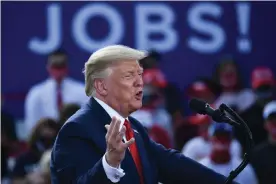  ?? Photograph: Brendan Smialowski/AFP/Getty Images ?? Donald Trump in August at a rally in Oshkosh, Wisconsin. Until February, Trump could have been confident he had made good on his promises – then came the virus.