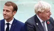  ?? ?? Tense...Mr Johnson and Mr Macron yesterday