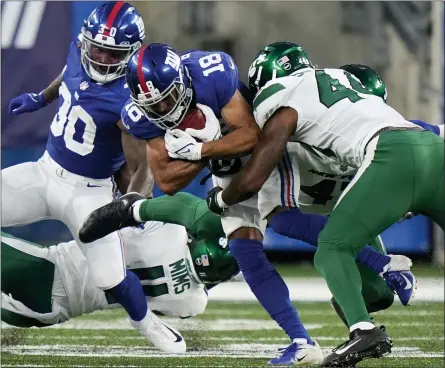  ?? COREY SIPKIN - THE ASSOCIATED PRESS ?? New York Giants wide receiver C.J. Board (18) is tackled by New York Jets linebacker Jamien Sherwood (44) in the first half of an NFL preseason football game, Saturday, Aug. 14, 2021, in East Rutherford, N.J.