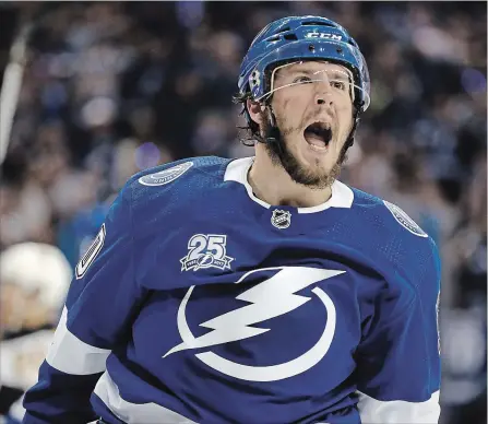  ?? CHRIS O'MEARA THE ASSOCIATED PRESS ?? Tampa Bay Lightning centre J.T. Miller celebrates after scoring against the Boston Bruins during the second period of Game 5 of their NHL Eastern Conference semifinal playoff series Sunday in Tampa, Fla. The Lightning won, 3-1, eliminatin­g the Bruins...