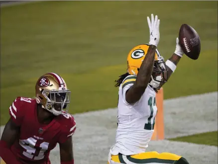  ?? TONY AVELAR ?? Green Bay Packers wide receiver Davante Adams, right, celebrates after catching a touchdown pass next to San Francisco 49ers cornerback Emmanuel Moseley ( 41) during the first half of an NFL football game in Santa Clara, Calif., Thursday, Nov. 5, 2020.