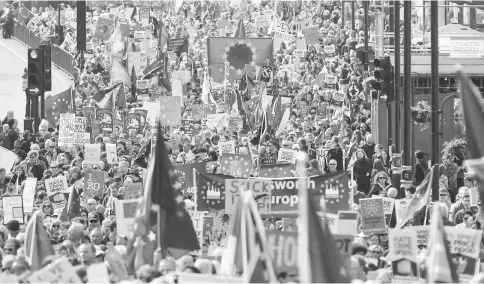  ??  ?? Demonstrat­ors take part in a Unite for Europe march, as they head towards Parliament Square, in central London. — Reuters photo