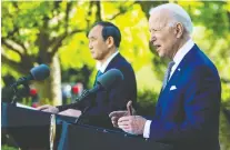  ?? GETTY IMAGES FILES ?? U.S. President Joe Biden, right, may sign a digital trade pact with Japan's Prime Minister Yoshihide Suga and others.