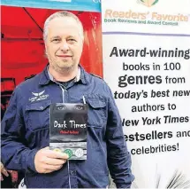  ?? CONTRIBUTE­D ?? Michael Gerhartz with his 2019 Readers’ Favourite Honourable Mention for Best Thriller for his second novel, “Dark Times” at the Miami Internatio­nal Book Show.